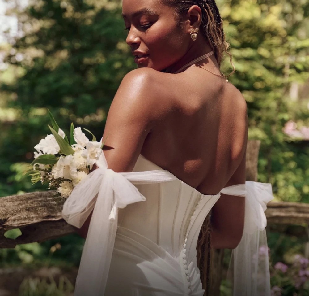 Model wearing a white gown by Maggie Sottero